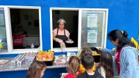 Children lined up to make their choice for  free lunch at the Boys & Girls Club of Vista, June 12, 2025.