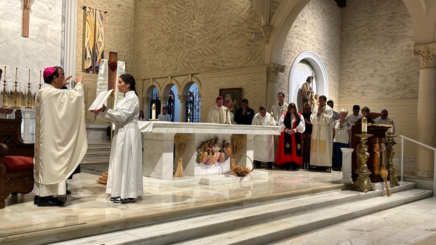 Bishop Michael Pham prays for a delegation of clergy and other immigrant supporters, Friday, at St. Joseph Cathedral, June 20, 2025.