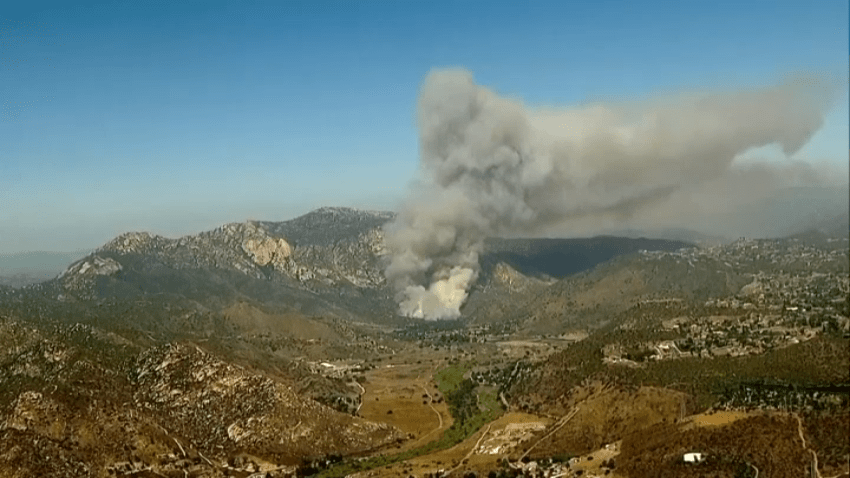 Smoke billows into the air as a wildfire burns in Lakeside, June 17, 2025.