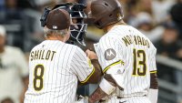 Jun 9, 2025; San Diego, California, USA; San Diego Padres manager Mike Shildt (8) gets in between home plate umpire Mike Estabrook and San Diego Padres third baseman Manny Machado (13) during the tenth inning against the Los Angeles Dodgers at Petco Park. Mandatory Credit: David Frerker-Imagn Images
