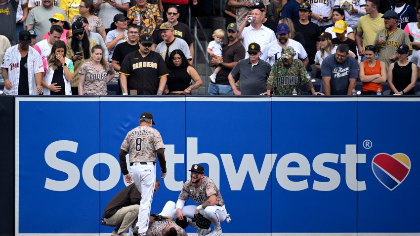 SAN DIEGO, CALIFORNIA – JUNE 01: Gavin Sheets #30 of the San Diego Padres lays on the field after colliding with the outfield wall during the fourth inning against the Pittsburgh Pirates at Petco Park on June 01, 2025 in San Diego, California. (Photo by Orlando Ramirez/Getty Images)