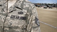 A United States Air Force (USAF) insignia decorates an officer's uniform