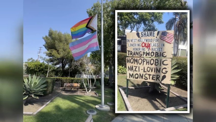 A sign shames the city of West Hollywood for lowering flags in honor of conservative speaker Charlie Kirk.