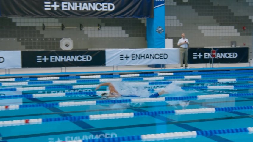 A freestyle swimmer in a pool.