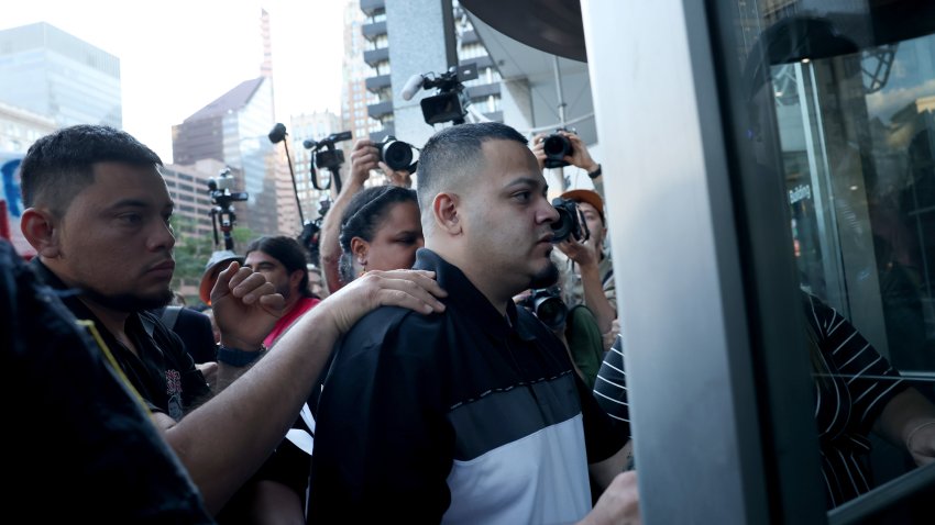 BALTIMORE, MARYLAND – AUGUST 25: Surrounded by reporters, Kilmar Abrego Garcia and his wife Jennifer Vasquez Sura enter a U.S. Immigration and Customs Enforcement (ICE) field office on August 25, 2025 in Baltimore, Maryland. The U.S. Government is threatening to deport Garcia, a Maryland construction worker from El Salvador, to Uganda after he rejected a plea deal to be charged with Human Smuggling and deported to Costa Rica. Earlier this year Garcia was wrongfully deported to a notorious anti-terrorism prison CECOT in El Salvador. (Photo by Anna Moneymaker/Getty Images)
