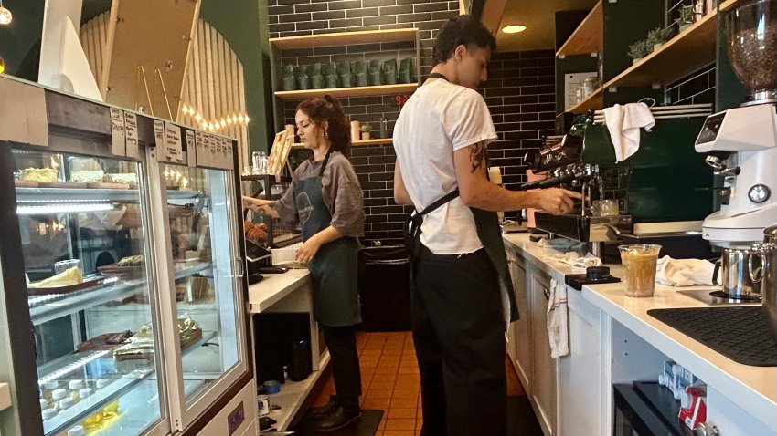 Karak House Coffee Company is a new business in Sorrento Valley. Employees Ravyn Bowen (left) and Nick James (right) prepare the signature drink, karak, a middle eastern spiced black tea with milk and ginger, Sorrento Valley, Calif., October 12, 2025.
