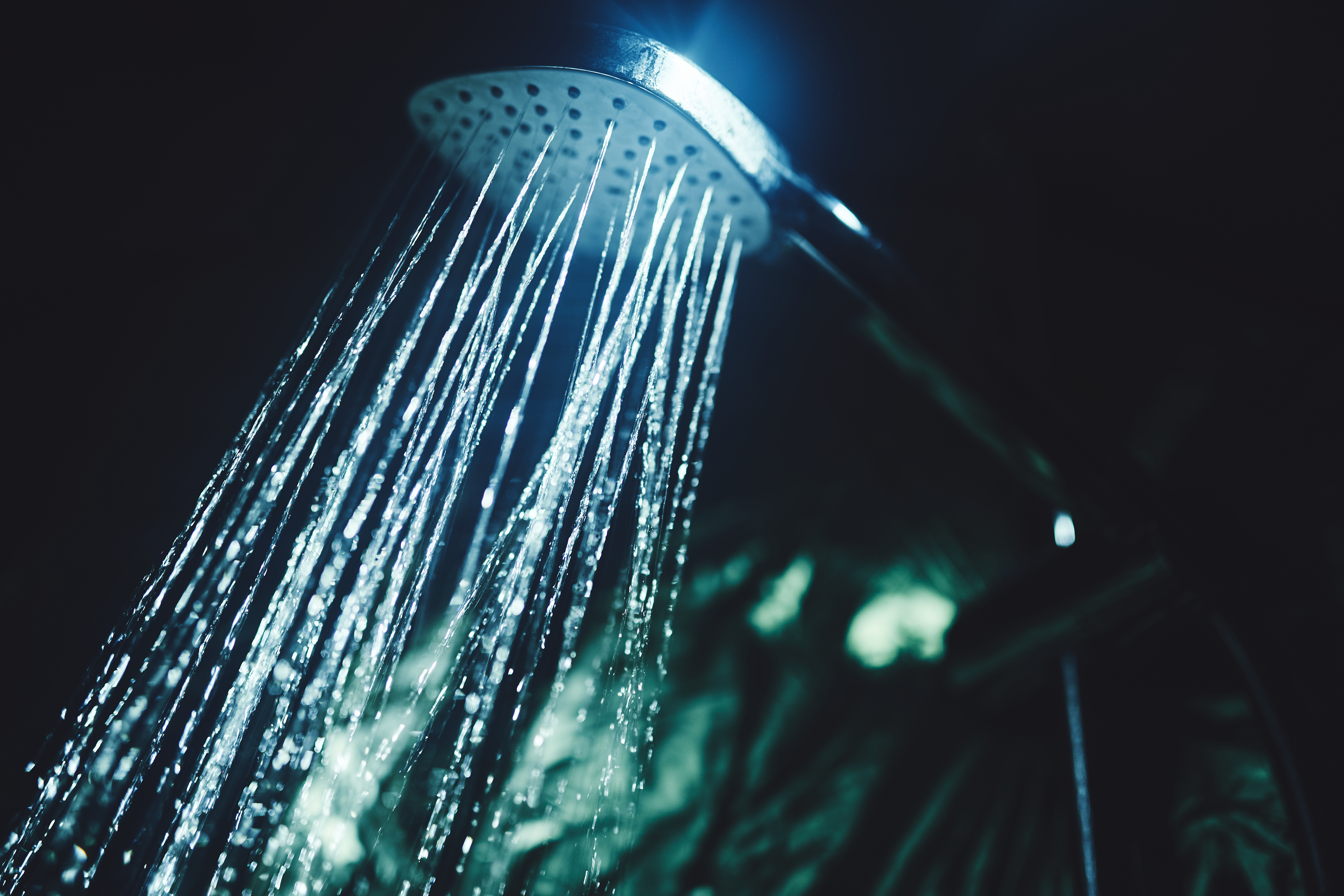 'Dark showering' for better sleep is going viral. Does it work?