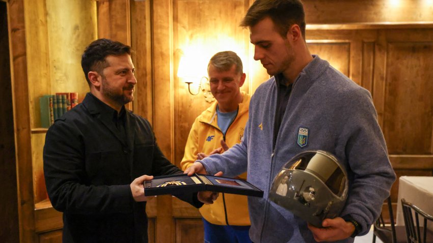 Ukrainian President Volodymyr Zelensky awards Ukrainian skeleton athlete Vladyslav Heraskevych a medal