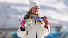 Jessie Diggins of Team USA celebrates after winning the Bronze medal for the Women's 10km Interval Start Free race.
