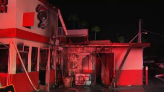 Firefighters put out the flames that scorched through Alfredo's Mexican Food in Oceanside overnight on Feb. 25, 2026. (NBC 7 San Diego)