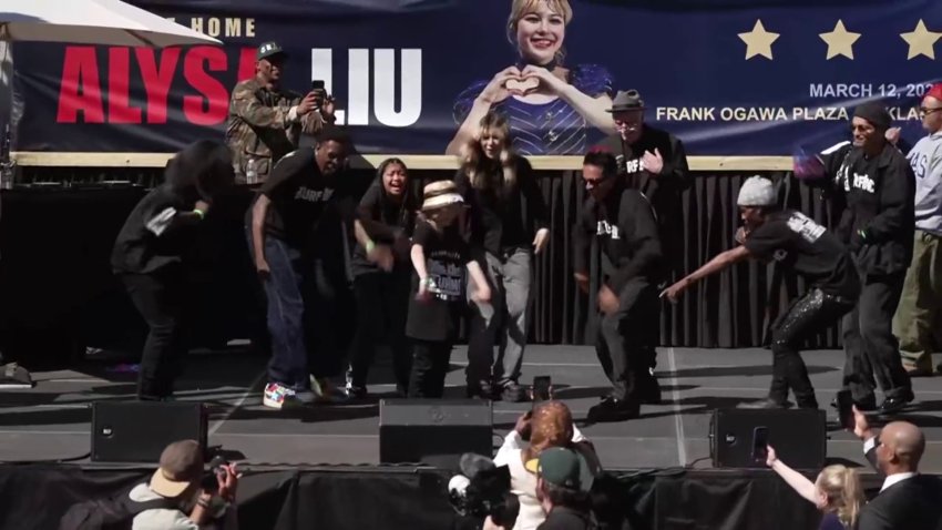 TURFinc dancers perform with Alysa Liu during a downtown Oakland rally celebration for the Olympic gold medalist. (March 12, 2026)