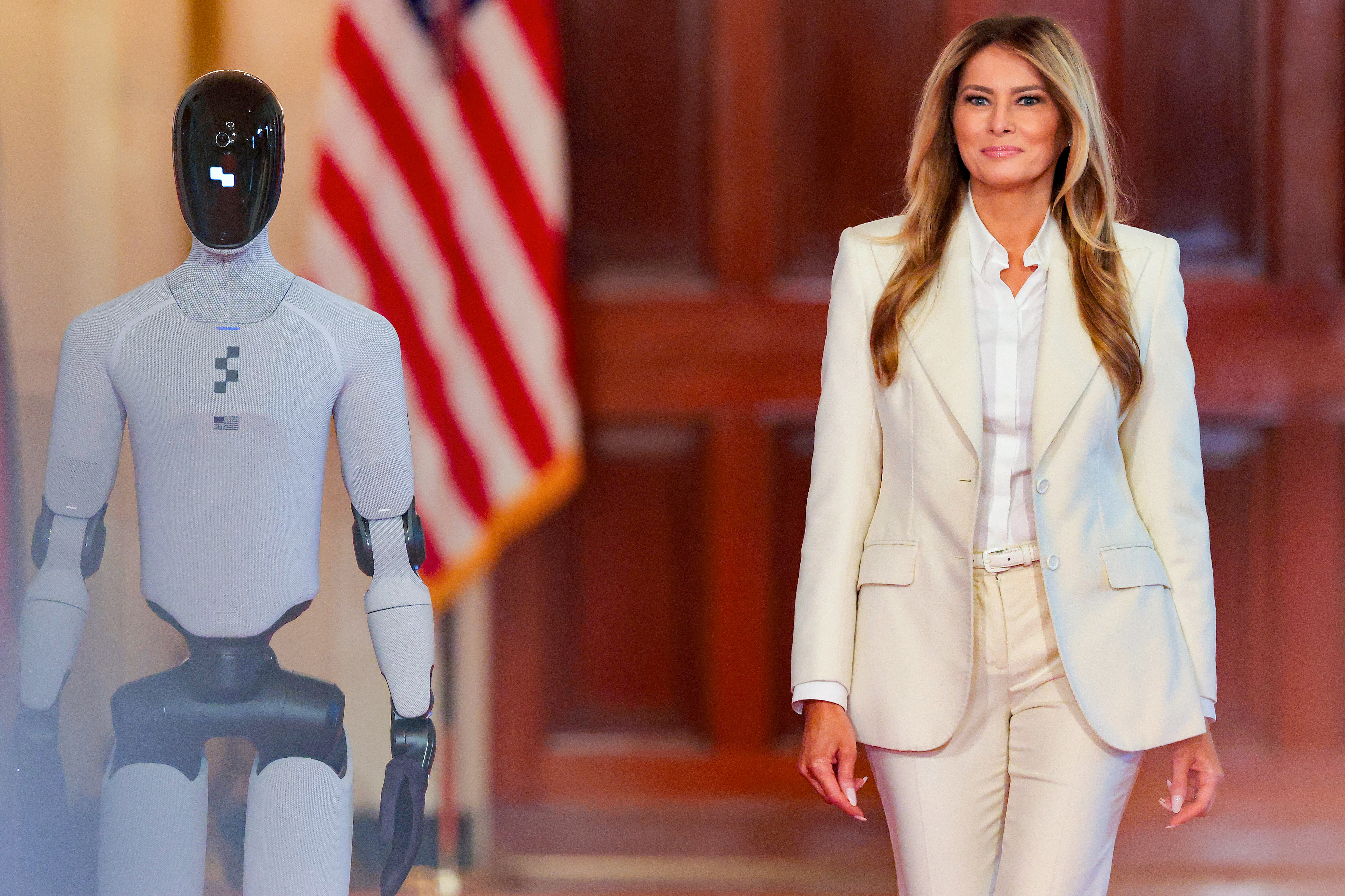 Melania Trump walks side-by-side with humanoid robot at White House summit