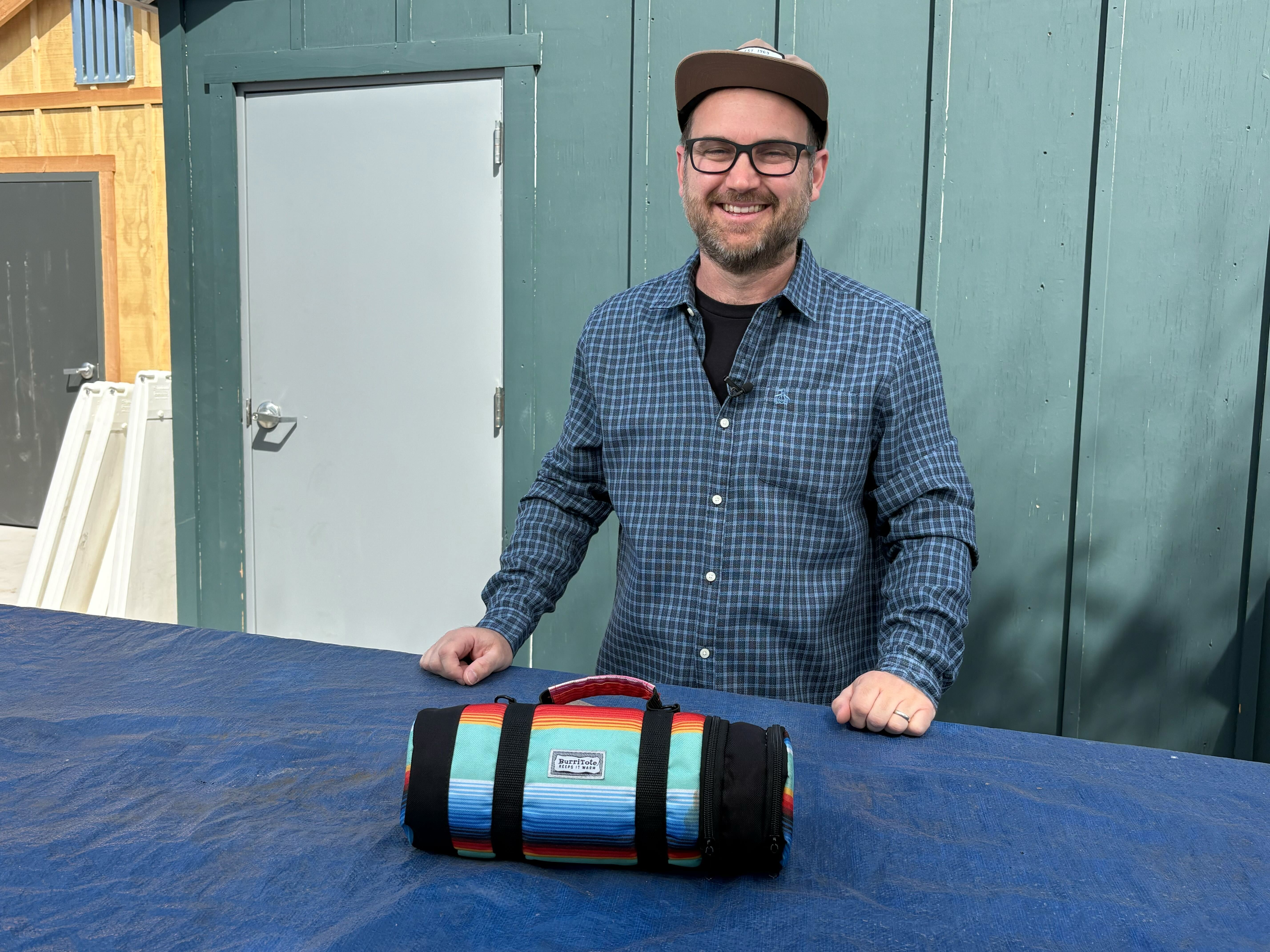 San Diego BurriTote Owner and Operator, Travis Dahl, with his personal BurriTote bag in Kearny Mesa on March 17, 2026. (NBC 7 San Diego)