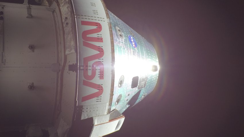 In this handout image provided by NASA, NASA’s Orion spacecraft is pictured here from one of the cameras mounted on its solar array wings. At the time this photo was taken at 8:33 a.m. ET, the Artemis II crew was in a sleep period ahead of beginning their seventh day into the mission.