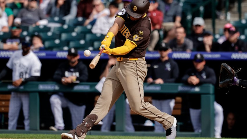 Apr 23, 2026; Denver, Colorado, USA; San Diego Padres first baseman Gavin Sheets (30) hits a three run home run in the ninth inning against the Colorado Rockies at Coors Field. Mandatory Credit: Isaiah J. Downing-Imagn Images