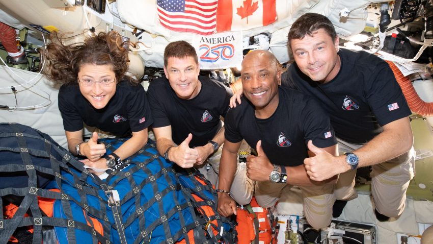 The Artemis II crew – (from left) Mission Specialist Christina Koch, Mission Specialist Jeremy Hansen, Pilot Victor Glover, and Commander Reid Wiseman – pause for a group photo inside the Orion spacecraft on their way home. Following a swing around the far side of the Moon on April 6, 2026, the crew exited the lunar sphere of influence (the point at which the Moon's gravity has a stronger pull on Orion than the Earth's) on April 7, and are headed back to Earth for a splashdown in the Pacific Ocean on April 10.