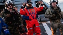 NASA astronaut Victor Glover celebrates on the flight deck of the San Antonio Class amphibious transport dock USS John P. Murtha (LPD 26) after returning from space on Apr. 10, 2026. John P. Murtha is underway in the U.S. 3rd Fleet area of operations supporting NASA’s Artemis II mission, retrieving the crew and spacecraft following their return to Earth and splashdown in the Pacific Ocean. NASA’s Artemis II mission sent four astronauts on a flight around the moon in the Orion space craft, marking the fi