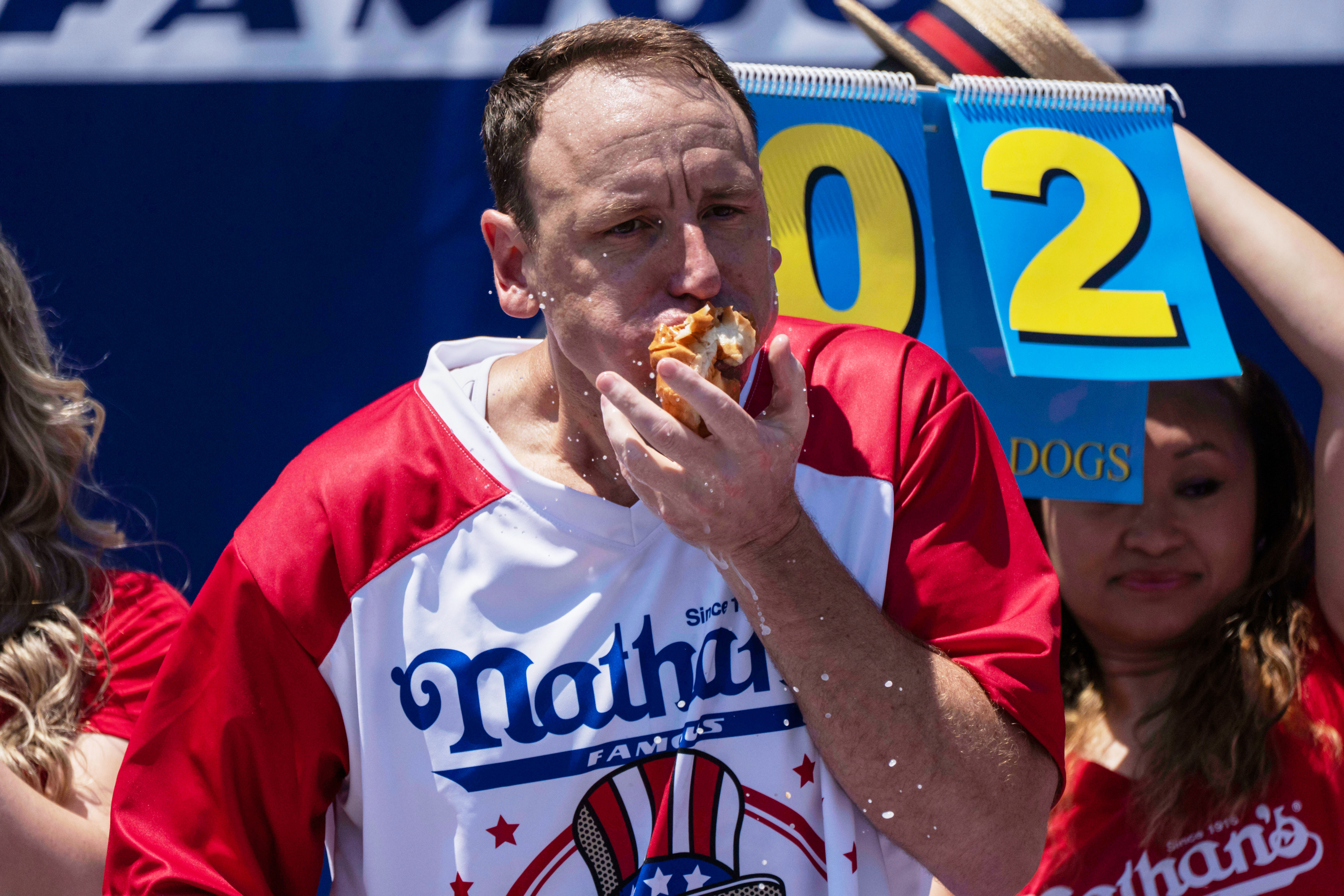 Joey Chestnut will defend hot dog eating title while on probation for battery
