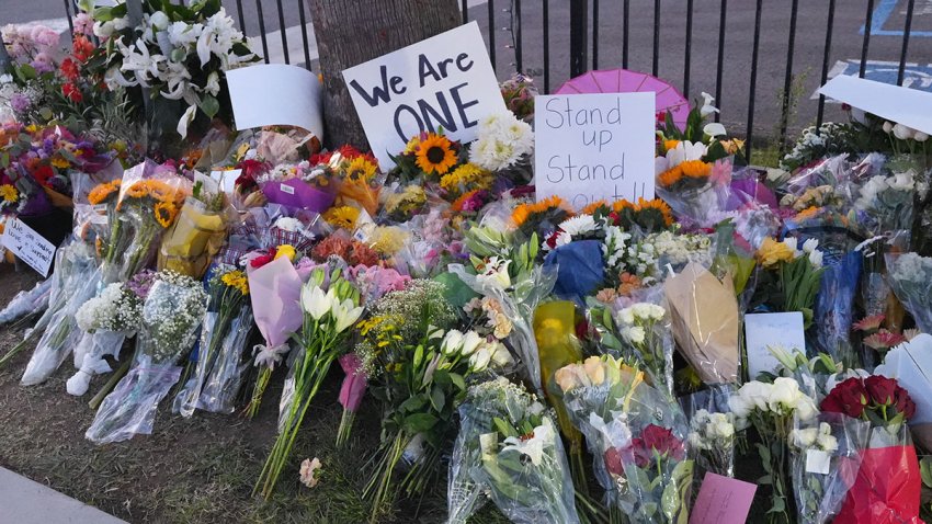 Flowers and candles are seen outside a mosque at the Islamic Center of San Diego during a vigil following a deadly shooting on May 19, 2026.