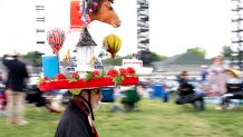 Tony Offutt wears a Kentucky Derby hat while walking in the infield at the 152nd Kentucky Derby in Louisville on Saturday, May 2, 2026.