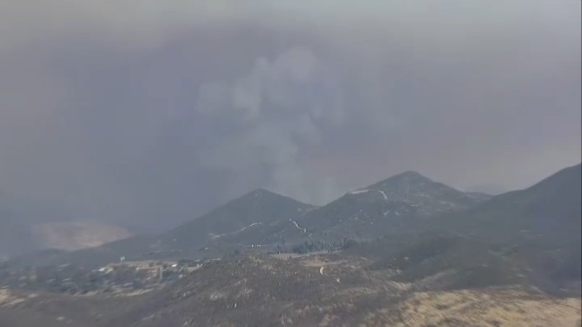 Cross-border brush fire quickly burns hundreds of acres