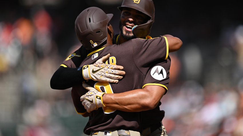 BALTIMORE, MD – JUNE 13: Xander Bogaerts #2 of the San Diego Padres, facing camera, hugs Samad Taylor #0 after Taylor hit a two-run home run in the first inning against the Baltimore Orioles at Oriole Park at Camden Yards on June 13, 2026 in Baltimore, Maryland. (Photo by Jamie Sabau/Getty Images)