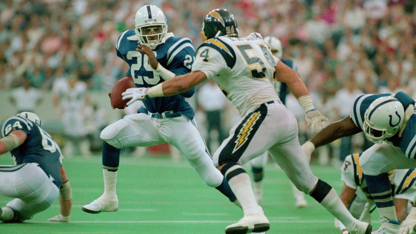 San Diego linebacker Billy Ray Smith blocks Indianapolis running back Eric Dickerson in 1987