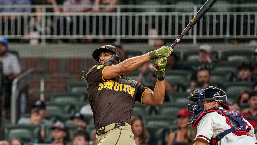 Jul 21, 2026; Cumberland, Georgia, USA; San Diego Padres right fielder Fernando Tatis Jr. (23) hits a home run against the Atlanta Braves during the ninth inning at Truist Park. Mandatory Credit: Dale Zanine-Imagn Images