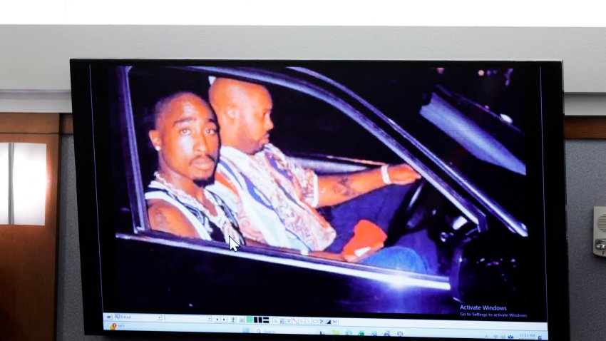 A 1996 photo of rapper Tupac Shakur (L) and Marion "Suge" Knight is displayed during the Duane Davis murder trial,