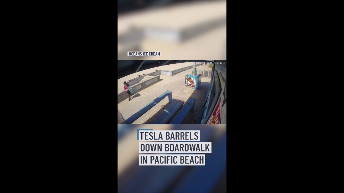 Tesla barrels down a boardwalk in Pacific Beach