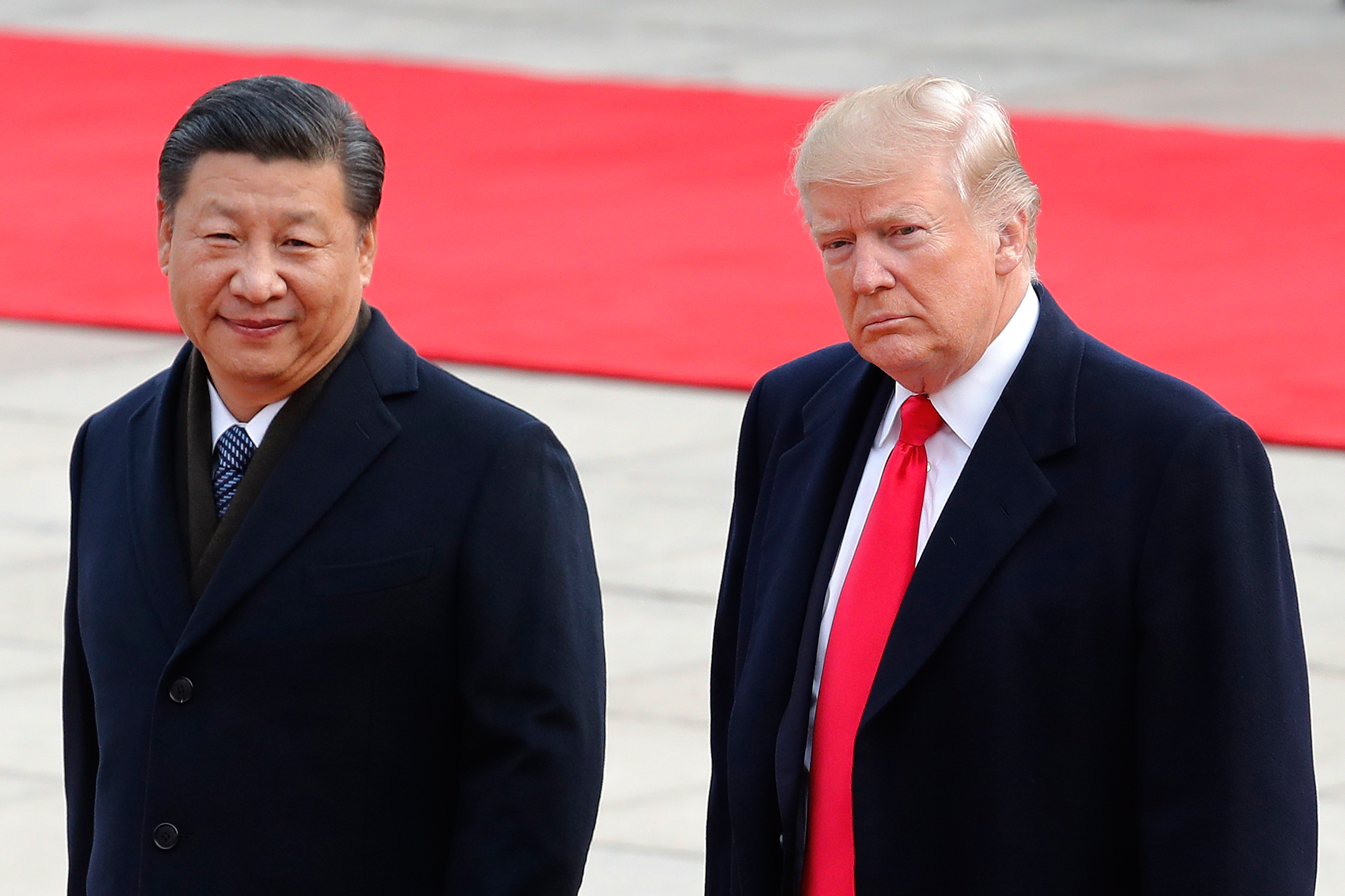 China's Xi kicks off state visit with a rare presidential airport welcome from Trump