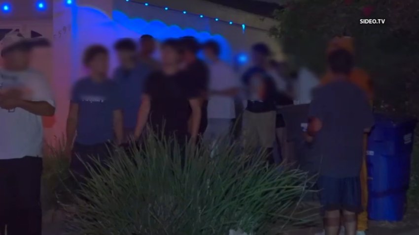 A group of people with faces blurred walk out from a house. September 15, 2026. CREDIT: SIDEO.TV