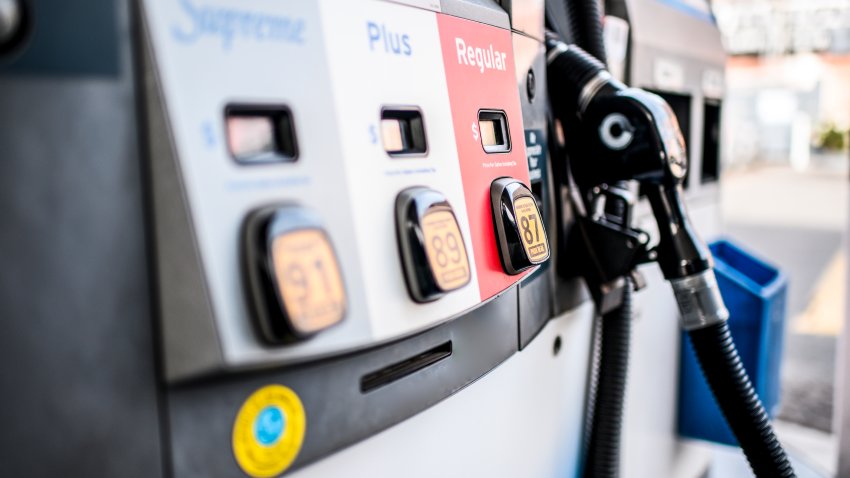 A fuel nozzle is shown at a gas station, with a selection of different types of fuel in this undated stock image.