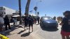 Tesla drives up onto Pacific Beach boardwalk after police chase, injuring woman
