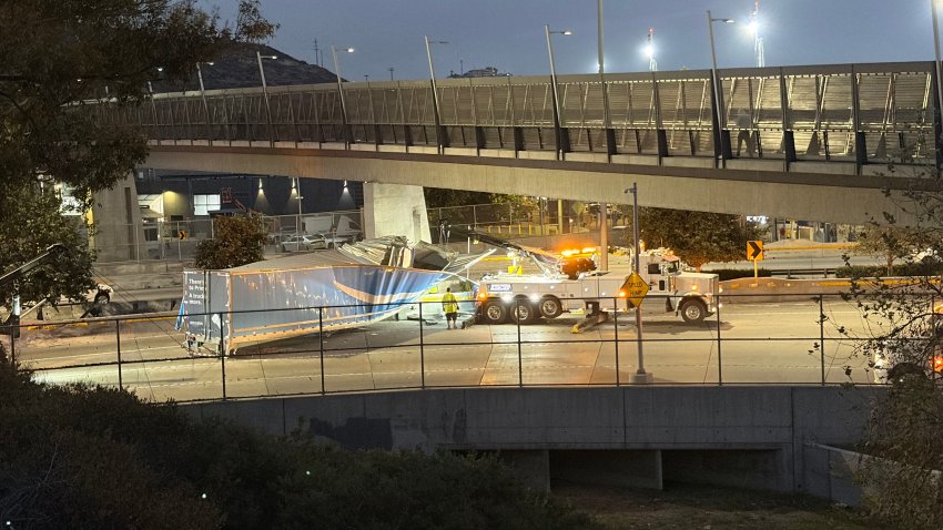 A damaged truck sits on the freeway. September 17, 2026.