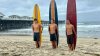 Surfers ride ‘old school' boards and raise money at OMBAC Classic to prevent drownings