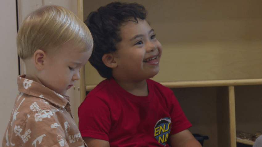 Two little boys in a classroom.