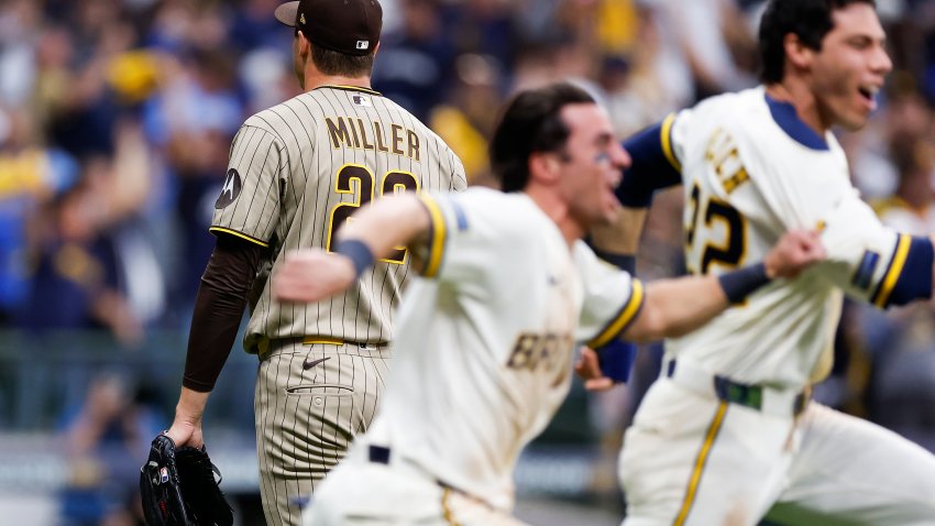 Milwaukee, Wisconsin – October 04: Mason Miller #22 of the San Diego Padres walks off the field as Milwaukee Brewers players celebrate defeating the Friars in Game 2 of the National League Division Series at American Family Field on Sunday, Oct. 4, 2026 in Milwaukee, Wisconsin. (Photo by Meg McLaughlin / The San Diego Union-Tribune via Getty Images)
