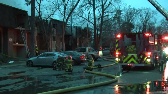 Father tosses son to firefighter from ladder escaping apartment blaze Father tosses son to firefighter from ladder escaping apartment blaze